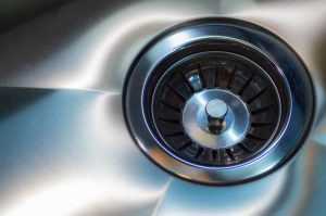 Stainless steel sink with drain. Closeup. Modern style chrome A stainless steel kitchen sink drain in Apollo Beach FL