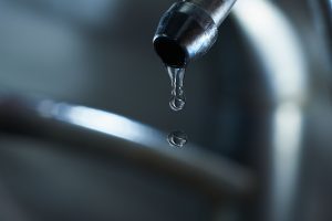 Reverse osmosis filter tap closeup with dripping water-drop. studio shot valrico, fl